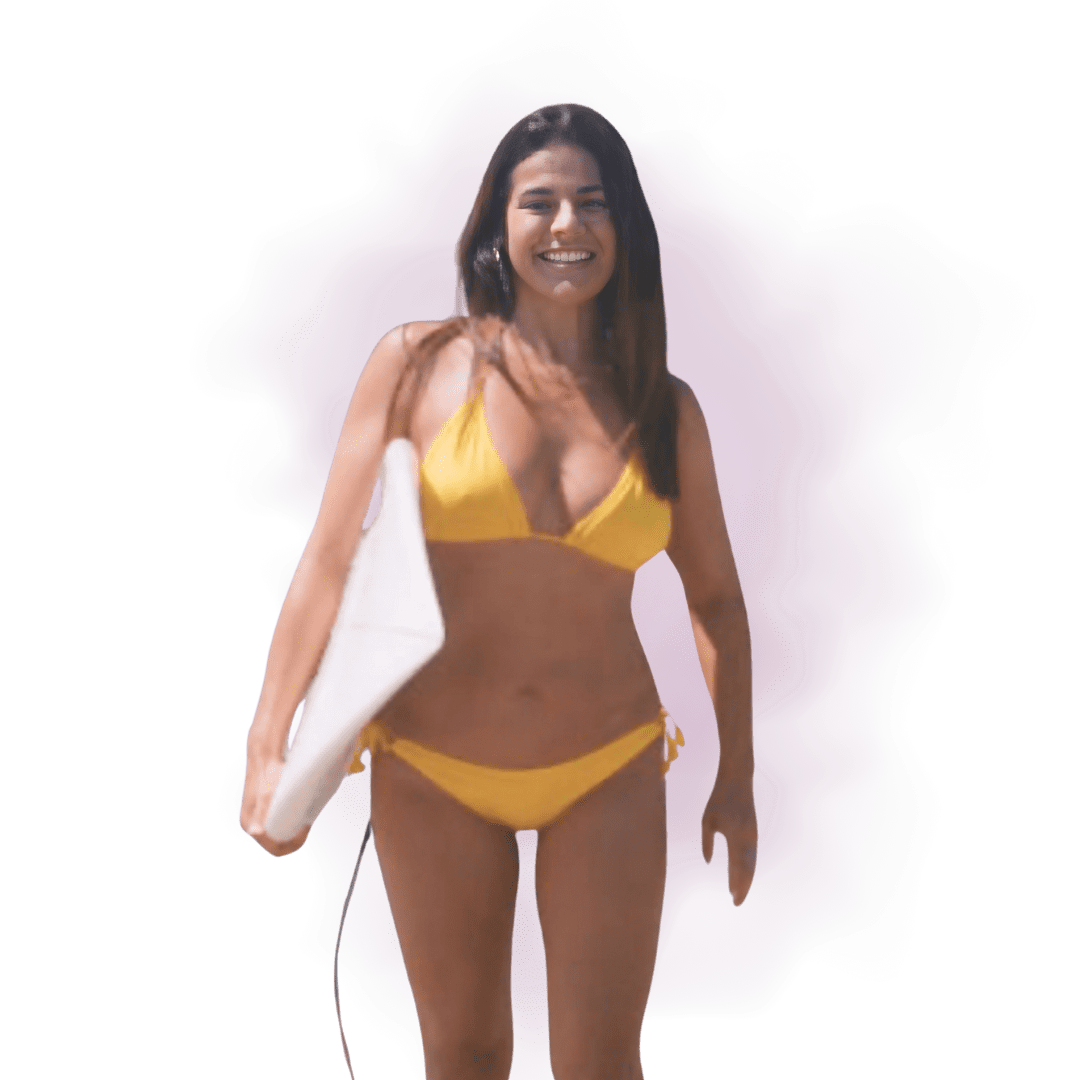 A woman in yellow bikini holding a surfboard.